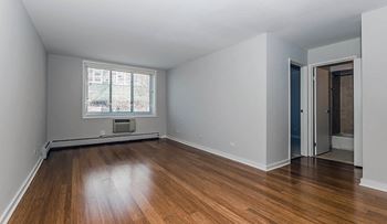 Hardwood floors in bedroom at Reside 707 Apartments, IL, 60613